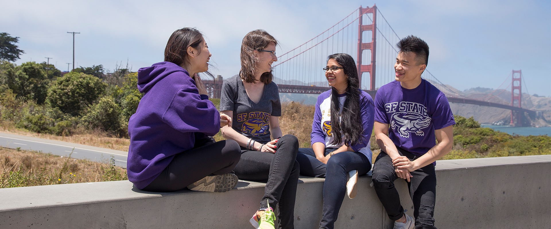 Students talking with Golden Gate Bridge in background