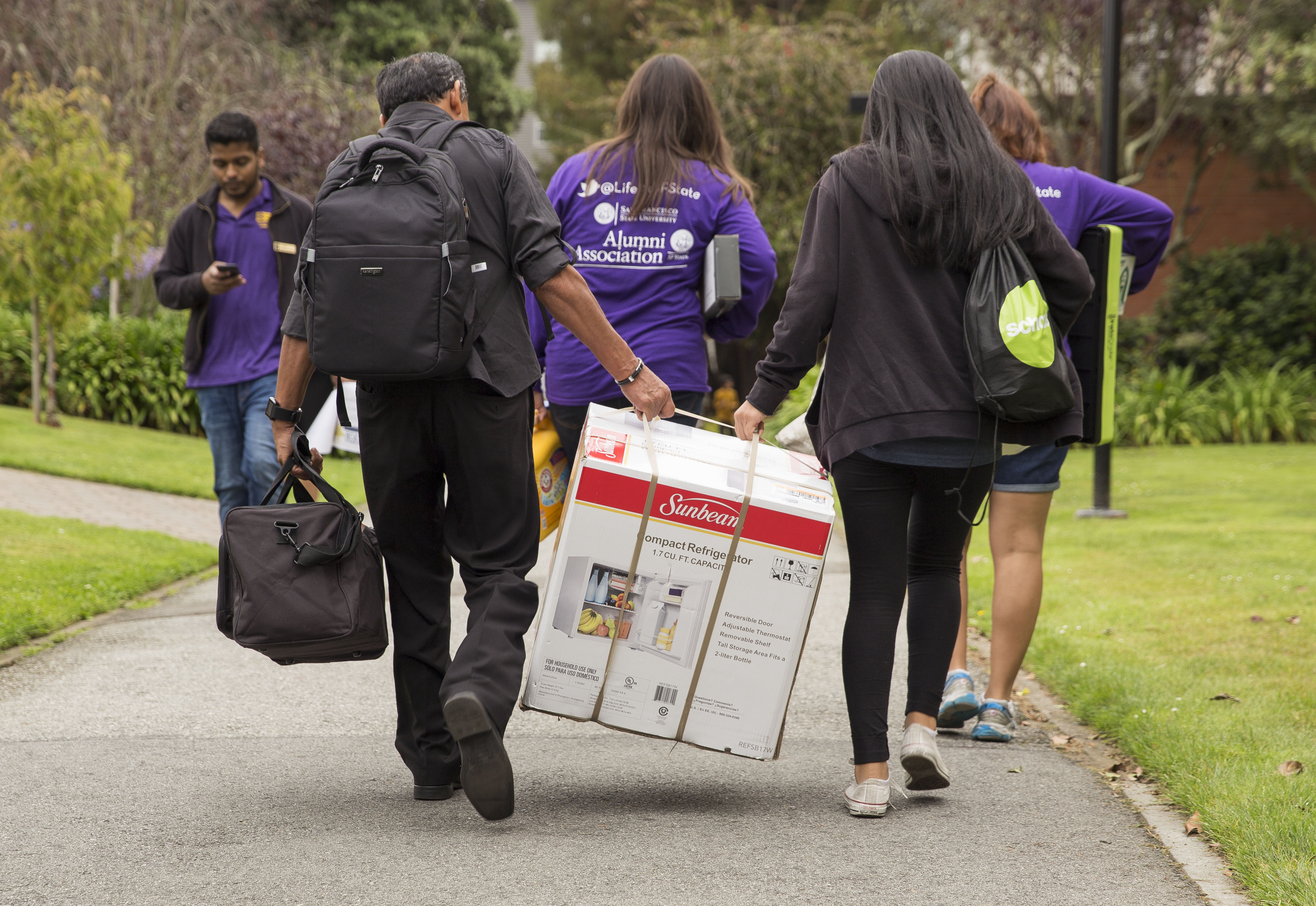 Students walking with boxes on Move-in day