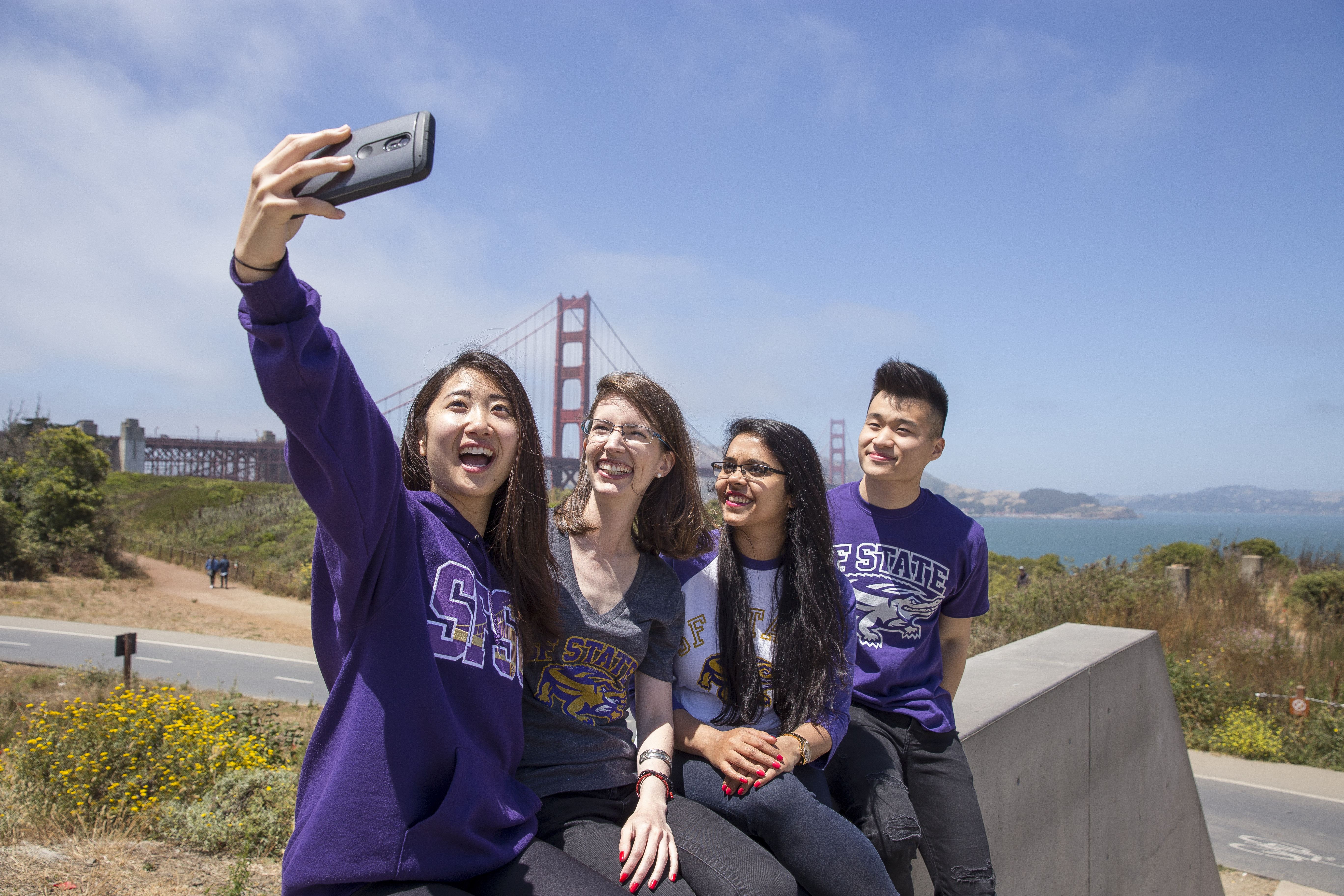 Students taking selfie with Golden Gate Bridge