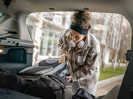 Student loading car at move-out