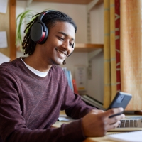 Student on phone in dorm