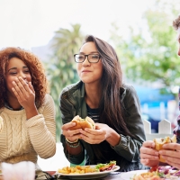 Students dining and laughing