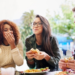 Students dining and laughing