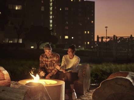 Students sitting at firepit