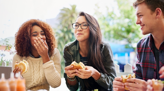 Students dining and laughing